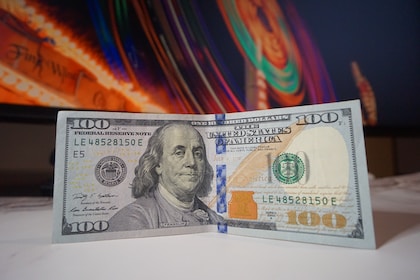 a one hundred dollar bill folded in half