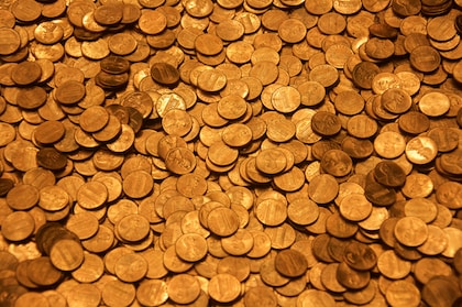 brown round coins on brown wooden surface